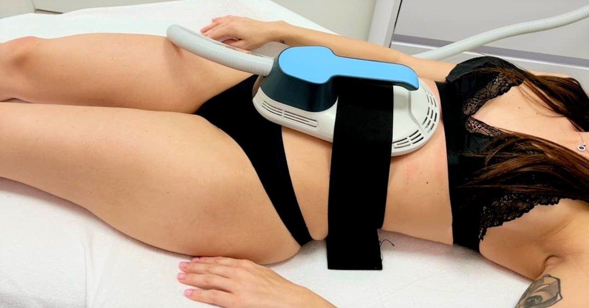 EMS Treatment applicators positioned on a client at Beauty & Shine, London SW8